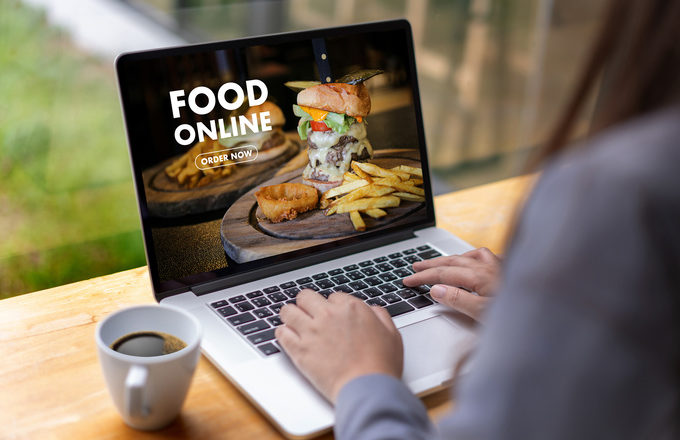 Close up woman ordering food online by internet Concept order food